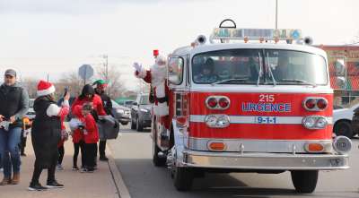 PHOTOS: Santa Makes His Way To Tecumseh Mall Atop A Fire Truck